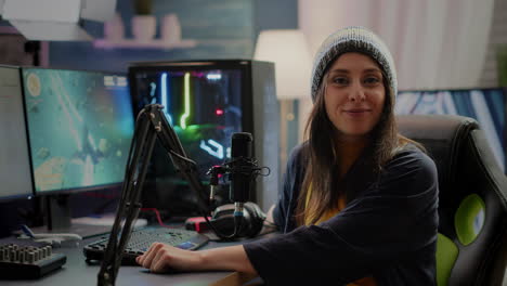 Cyber-woman-streamer-looking-at-camera-and-smiling