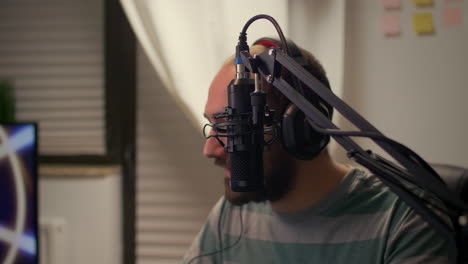 Close-up-of-streamer-man-talking-into-microphone