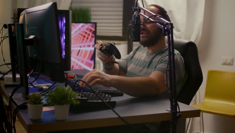 Side-view-of-pro-streamer-man-with-headphones