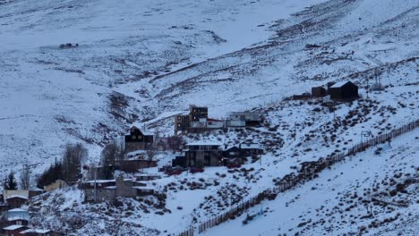 Aerial-parallax-shot-of-houses-built-next-to-the-Farellones-Ski-Resort-in-the-Andes