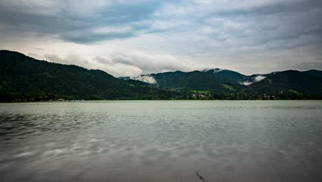 time-lapse-at-tegernsee-with-clouds-in-the-sky-and-in-the-mountains