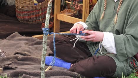 Viking-re-enactment-hand-weaving-cloth-in-the-traditional-viking-way-at-Waterford-Ireland