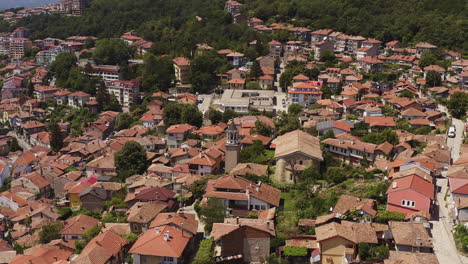 Drone-flies-towards-American-collage-Arcus-in-medieval-city-Veliko-Tarnovo