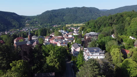 Aerial-pullback-over-spa-town-of-Badenweiler-set-in-lush-countryside,-Germany
