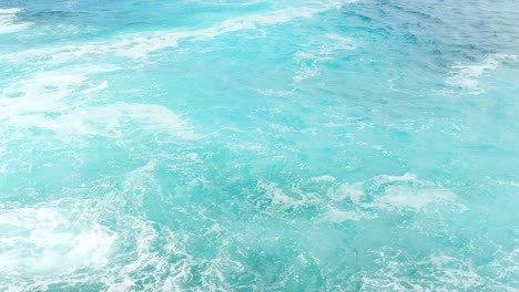 Agitated-turquoise-emerald-sea-waves-with-white-foam-in-Alcala,-Tenerife