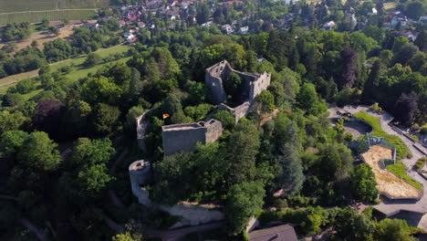 Drone-pullback-from-ancient-Burg-Baden-atop-hillside-overlooking-Badenweiler