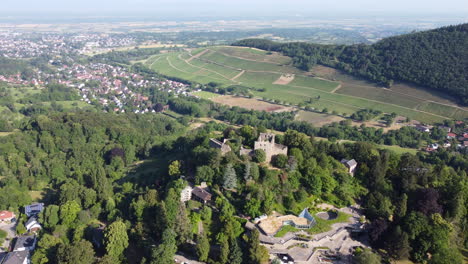 Panoramic-aerial-view-over-Badenweiler-castle-ruins,-Black-Forest,-Germany