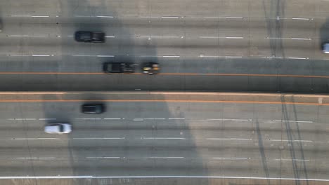 Highway-Traffic-Aerial-Drone-Looking-Down-on-8-Lane-Interstate
