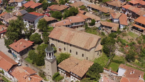 Church-bell-tower-among-red-terracotta-rooftops-of-Veliko-Tarnovo
