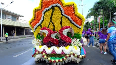 A-motor-vehicle-decorated-with-colorful-flowers-on-a-road-parade