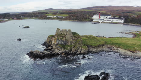 Whisky-Distillery-Aerial-Lagavulin-relvealing-behind-Dunivaig-Castle-in-front