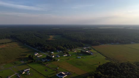 An-aerial-view,-high-up-over-vast-farmlands-in-Delaware-on-a-sunny-day