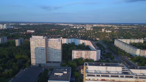 Fantastic-aerial-top-view-flight-Panel-system-building,-prefabricated-housing-complex,-Berlin-Marzahn-East-Germany-golden-hour-2023