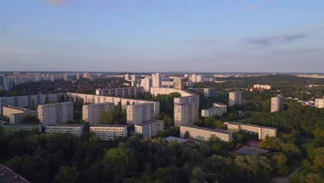 Nice-aerial-top-view-flight-Panel-system-building,-prefabricated-housing-complex,-Berlin-Marzahn-East-Germany-golden-hour-2023
