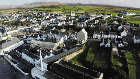 Whisky-Distillery-Aerial-Bowmore-Church-in-Background