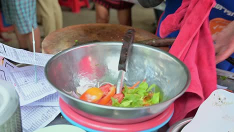 Preparing-vegetable-salad-of-tomatoes