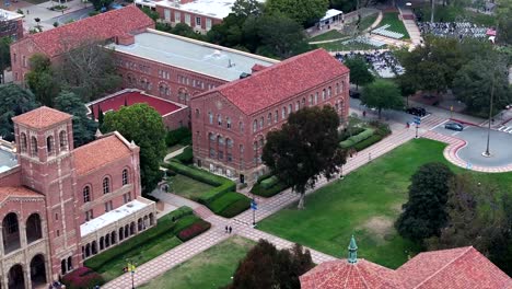 Aerial-Flying-Past-Dickson-Court-At-UCLA-With-Students-Outside-The-Royal-Hall-Building
