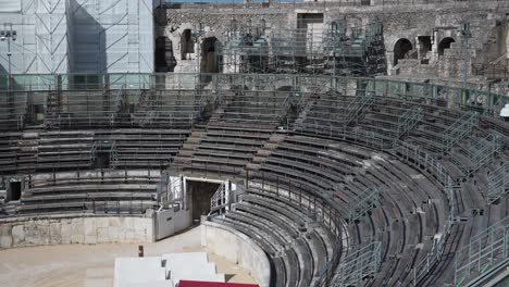 Slow-tilting-shot-of-construction-and-renovations-happening-to-the-Nimes-Arena