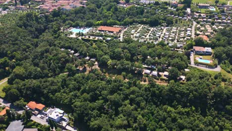 Aerial-Shot-of-Weekend-Glamping-Resort-and-Surrounding-Nature-near-Lake-Garda,-Italy