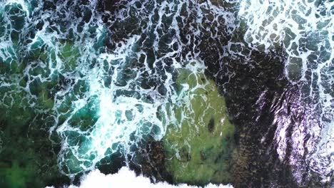 aerial-view-of-blue-ocean,-waves-crashing,-4k