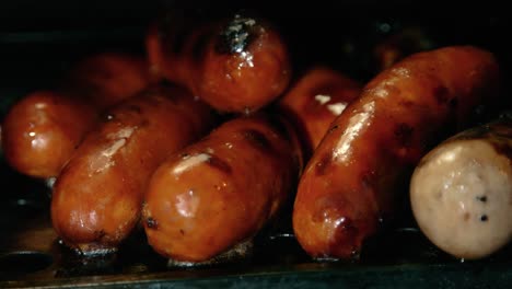 Cooked-Pork-Sausages-Lying-on-Warming-Grate-of-BBQ-after-Cooking