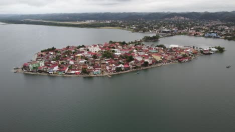 Aerial-orbits-Flores-Island-in-Peten-Itza-lake-in-northern-Guatemala