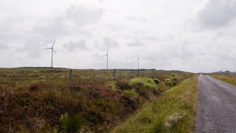 Shot-of-a-windy-moorland-wind-farm-by-a-track-road-on-the-Hebrides