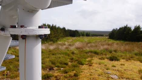 Shot-of-nuts-and-bolts-beside-a-wind-turbine-with-moor-and-peatland