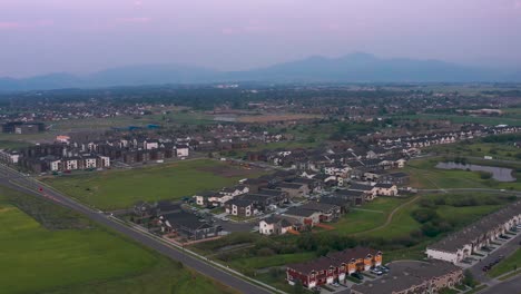 New-rapid-development-suburban-town-home-and-apartments-sprawl-across-bozeman-montana,-aerial-pedestal
