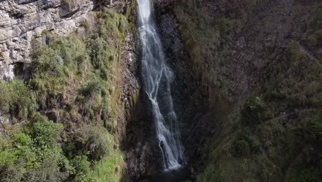 Capture-the-serenity-with-a-static-drone-shot-of-Candela-Fasso-waterfall-in-Cotopaxi,-Jatun-Era