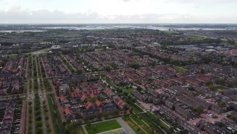 Aerial-view-of-suburban-village-with-soccer-field