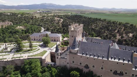 Aerial-Shot-Of-Alcazar-of-Segovia-Castle-Beside-Plaza-la-Reina-Victoria-Eugenia