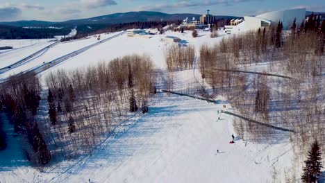 4K-Drone-Video-of-Sledding-in-Hill-at-University-of-Alaska-Fairbanks-on-Snowy-Winter-Day