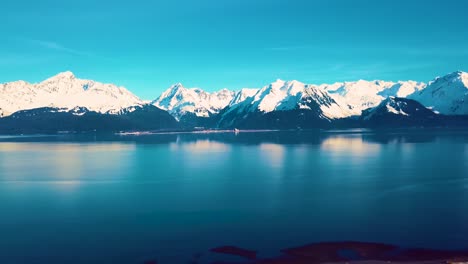 4K-Drone-Video-of-Seward,-Alaska-Beach-and-Surrounding-Snow-Covered-Mountains-on-Snowy-Winter-Day