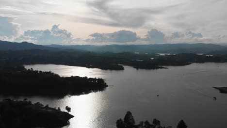 Aerial-drone-shot-of-Guatape-lake-in-the-mountains-of-Colombia-during-the-afternoon