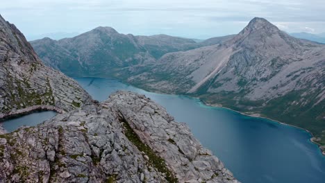 Aerial-View-Of-Salberget-Mountain-Peak-and-Fjord-In-Flakstadvag,-Norway