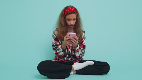 Child-girl-kid-use-mobile-smartphone-browsing-say-Wow-yes-found-out-great-win-good-news-celebrate