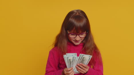 Rich-pleased-girl-child-kid-waving-money-dollar-cash-bills,-success,-lottery-winner,-income,-wealth