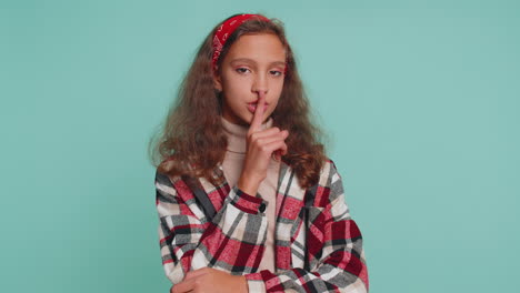 Preteen-child-girl-presses-finger-to-lips-makes-silence-hush-sign-do-not-tells-gossip-secret,-quiet