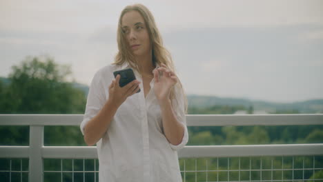Thoughtful-Woman-Browsing-Smartphone