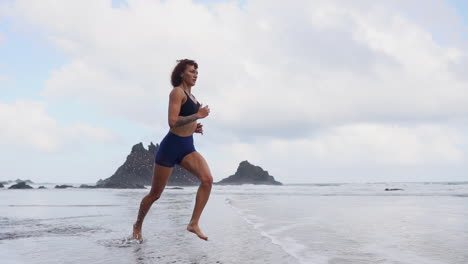 Morning-Glory:-Curvaceous-Athlete's-Beachside-Run-in-Slow-Motion-with-Clouds