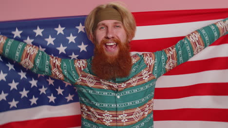 Hippie-redhead-bearded-man-waving-wrapping-in-American-USA-flag,-celebrating,-human-rights,-freedoms
