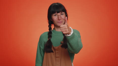 Hipster-woman-raises-thumbs-up-agrees-or-gives-positive-reply-recommends-advertisement-likes-good