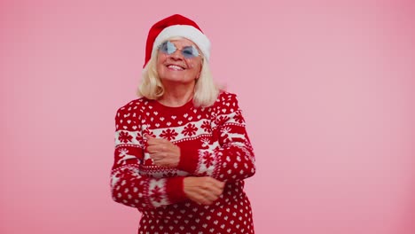 Mature-Christmas-grandmother-woman-dancing-trendy-dance-for-social-media-fooling-around-having-fun