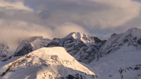 Time-lapse-of-some-clouds-over-snowy-mountains