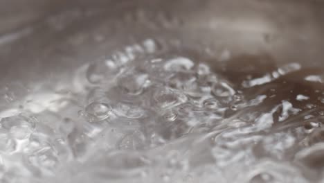 Boiling-water-with-bubbles-in-pan