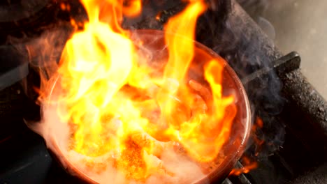 Cooking-shrimps-in-frying-pan-with-flame