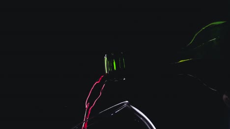 Red-wine-in-wineglass-on-black-background