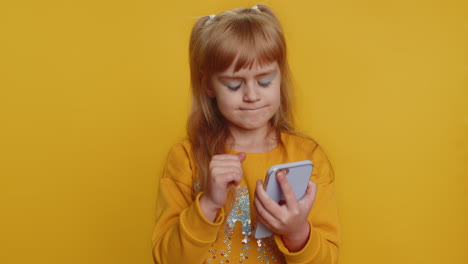 Young-surprised-displeased-toddler-school-girl-child-kid-use-smartphone-bad-fortune,-loss,-unlucky