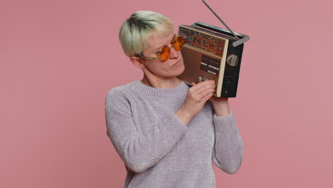 Millennial-woman-use-retro-vintage-tape-record-player,-listen-music,-disco-dancing-of-favorite-track